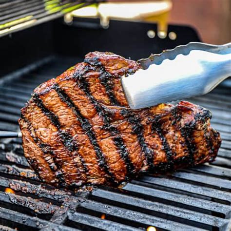grilling sirloin steak on a gas grill